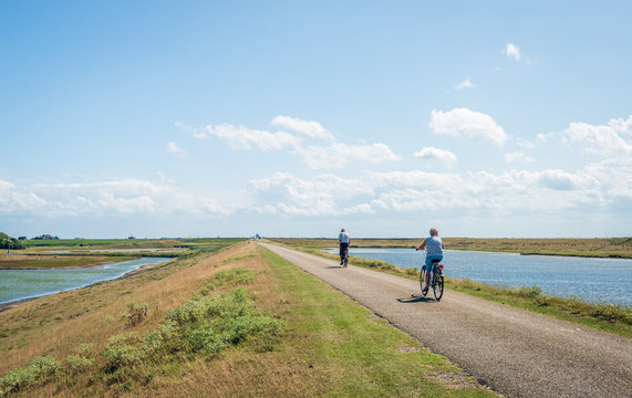 Cyclists on a Dutch dike