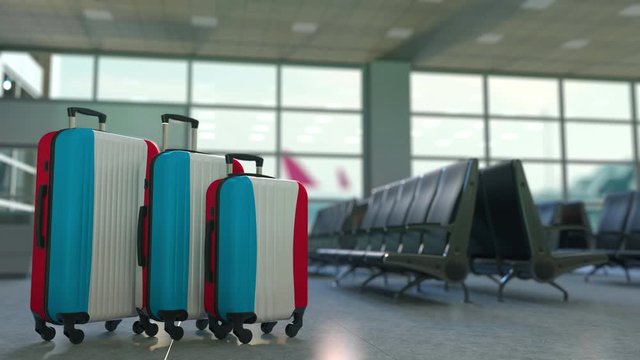 Travel suitcases with flag of Luxembourgh. Luxembourghian tourism conceptual 3D animation