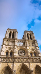 Fototapeta na wymiar Vertical of Basilica of the Sacre Couer on Montmartre with blue sky and clouds , Paris, France. Catholic church cathedral is popular in Europe