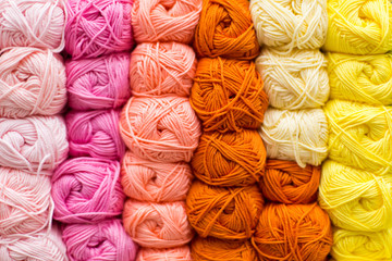 Shelf with a lot of color yarn for diy knitting. Selection of colorful yarn wool on shopfront....