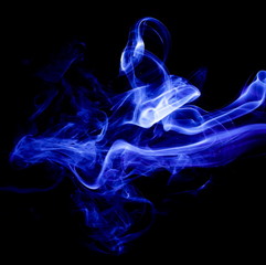 Fototapeta premium Blue smoke on black background