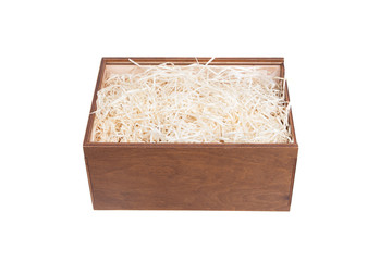 Open wooden box with filling material inside. Empty natural wooden box with decorative straw for happy gifts.