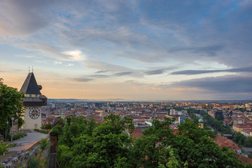 Naklejka premium Cityscape of Graz and the famous clock tower (Grazer Uhrturm) on Shlossberg hill, Graz, Styria region, Austria