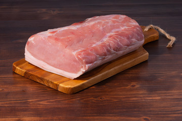 Raw pork on cutting board. clouse up
