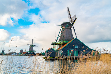 View of dutch windmills near the river Zaan in the Village of Zaanse Schans