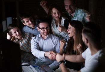 handshake of business people in the circle of colleagues