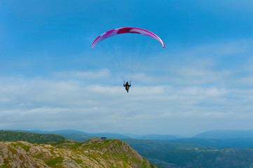 Beautiful landscape with paraglider seen from the Mount Ulriken in Bergen, Norway, on August 4 2019