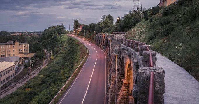 Time lapse traffic from elevated stone walkway