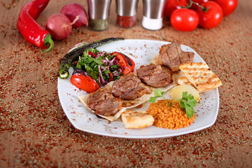 Turkish pirzola with fresh peppercorns fresh tomatoes and vegetables