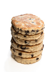 Stack of iced Welsh cakes isolated on white