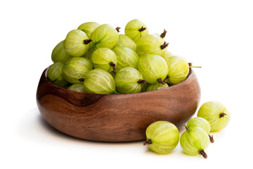 Gooseberries in wooden table isolated on white