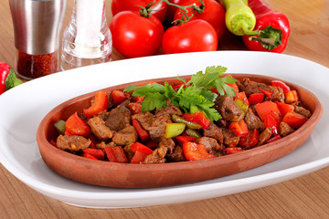 Turkish feed of meat pepper tomatoes and vegetables in a pottery