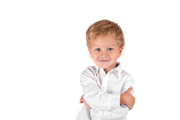 Waist up portrait of a little smiling boy against a white background with copy space in the studio