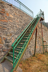 Steel stairs and rock walls