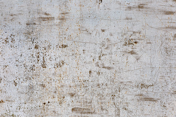 Old gray painted metal surface with cracks and scratches. Grunge texture.