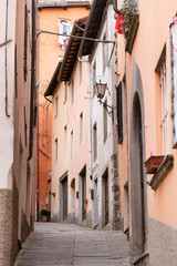 The Town Of Barga. Italy. Summer 2019. Narrow street rising up. Street in the Central part of the historic center.