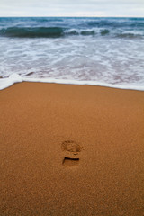 Summer sandy beach with footprint