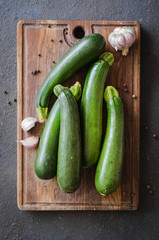 Fresh organic zucchini, garlic and parsley, herbs and spices.
