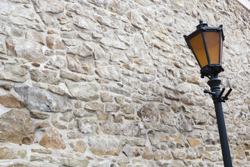 Street Light at Stone Wall Background. Monastery of the Poor Clares in the Stary Sacz, Poland.