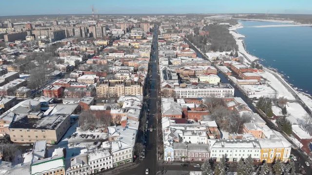 Snowy city in winter and river pier