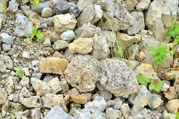 Natural stone dolomite in the limestone open-pit. Building materials, wall background, texture