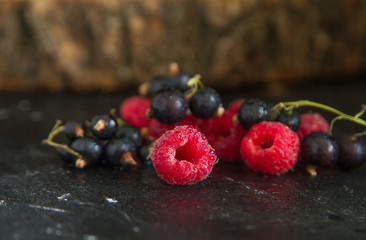fresh organic berries on a black background