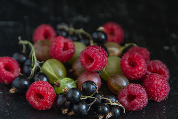 fresh organic berries on a black background