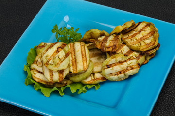 Grilled eggplant slices served basil