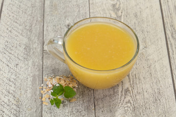 Dietary vegetarian oats milk over wooden