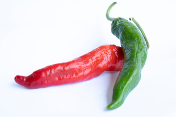 Fresh green chilli pepper and dry red chilli pepper. Isolated on white background.