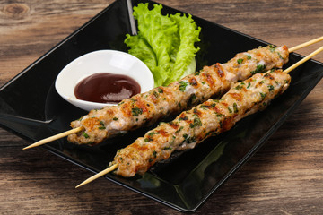 Minced pork skewer kebab with sauce
