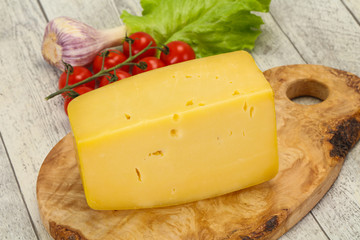 Hard yellow tasty cheese brick