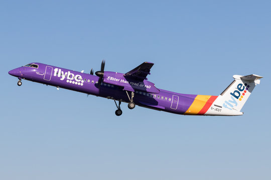 VIJFHUIZEN, THE NETHERLANDS - June 28, 2019: British flybe Bombardier DHC-8-400 Dash 8 with registration G-JEDT just airborne at Amsterdam Airport Schiphol.
