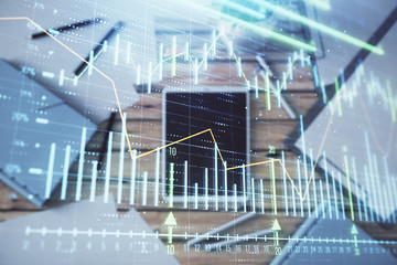 Naklejka premium Double exposure of forex graph on digital tablet laying on table background. Concept of market analysis