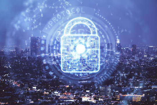 Lock icon hologram on city view with skyscrapers background multi exposure. Data security concept.
