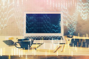 Multi exposure of graph and financial info and work space with computer background. Concept of...
