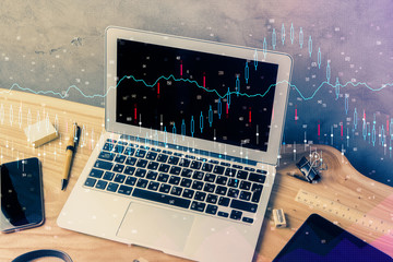 Double exposure of forex graph and work space with computer. Concept of international online trading.