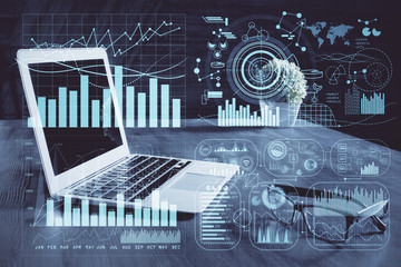 Financial graph colorful drawing and table with computer on background. Double exposure. Concept of international markets.