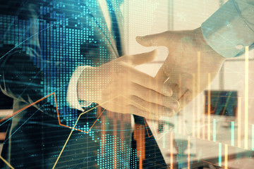 Multi exposure of financial chart and map on office background with two businessmen handshake. Concept of success in business