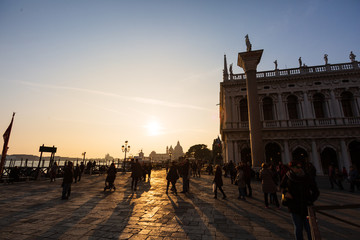 Obraz premium Traditional gondola and The Grand Canal and the Basilica di Santa Maria della Salute in Venice at sunset