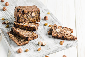 Gluten-free bread with hazelnut and flax seeds on a wooden Board
