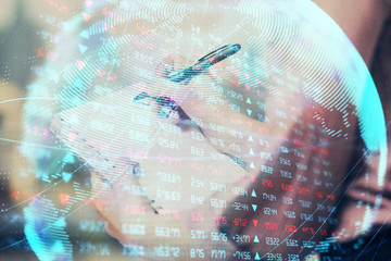 International business hologram over hands taking notes background. Concept of success. Multi exposure