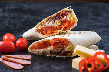 Shawarma sandwich gyroscope fresh roll of lavash Lavash chicken beef Shawarma falafel recipe tin eats stuffed with roasted meat, mushrooms, cheese. Traditional middle Eastern snack.