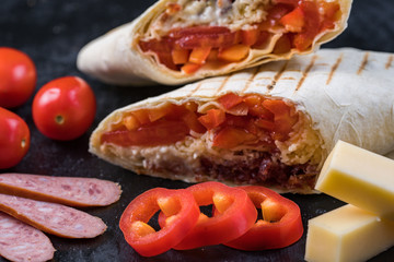 Shawarma sandwich gyroscope fresh roll of lavash Lavash chicken beef Shawarma falafel recipe tin eats stuffed with roasted meat, mushrooms, cheese. Traditional middle Eastern snack.