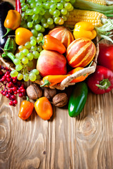 The table, decorated with vegetables and fruits. Harvest Festival. Happy Thanksgiving. Autumn background. Selective focus.