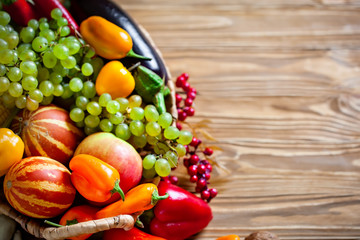 The table, decorated with vegetables and fruits. Harvest Festival. Happy Thanksgiving. Autumn background. Selective focus.