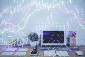 Forex market graph hologram and personal computer on background. Multi exposure. Concept of...