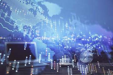 Stock market graph and table with computer background. Multi exposure. Concept of financial analysis.