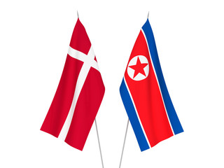 National fabric flags of North Korea and Denmark isolated on white background. 3d rendering illustration.