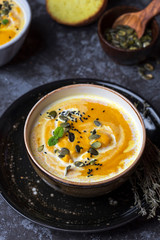 Pumpkin cream soup with lentils and pumpkin seeds